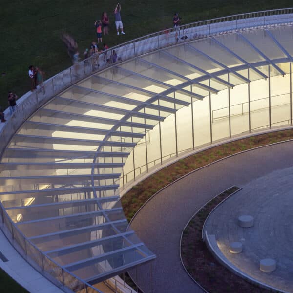 close up of gateway arch museum building at dusk