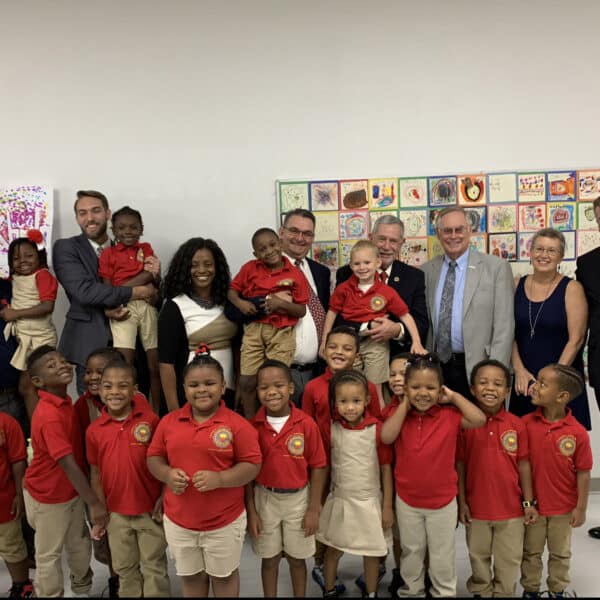 group photo of students and teachers at early childhood center